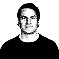Halftone black and white image of Peter Kennedy